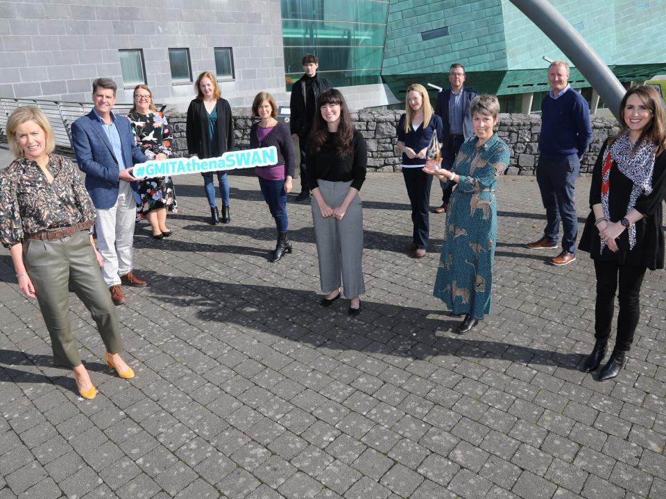 Group holding Athena Swan sign in front of GMIT