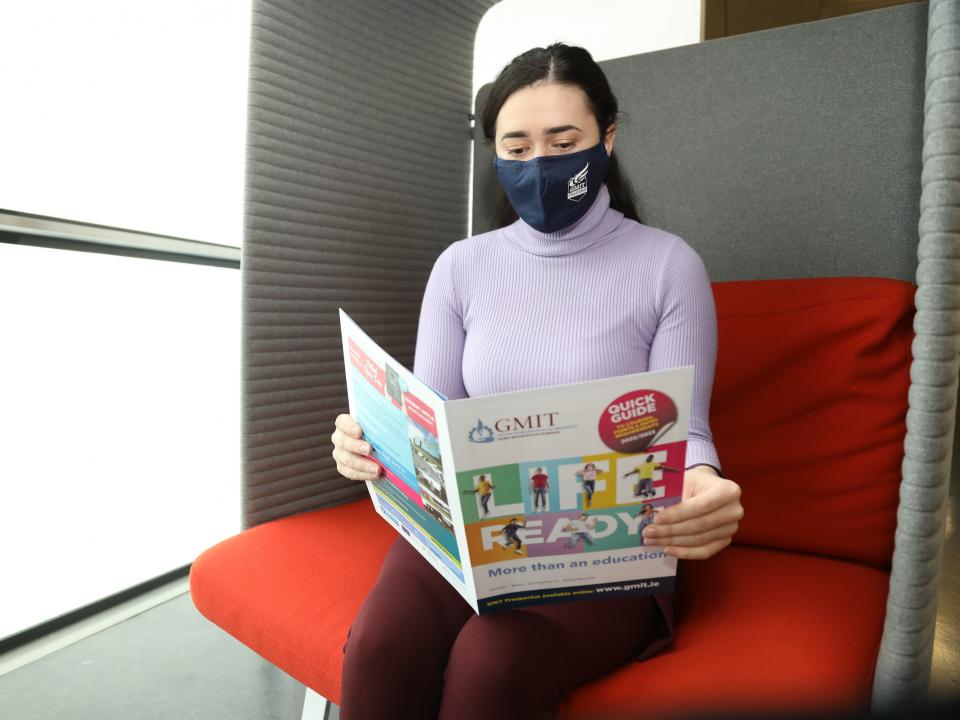 Student with brochure at GMIT Galway campus