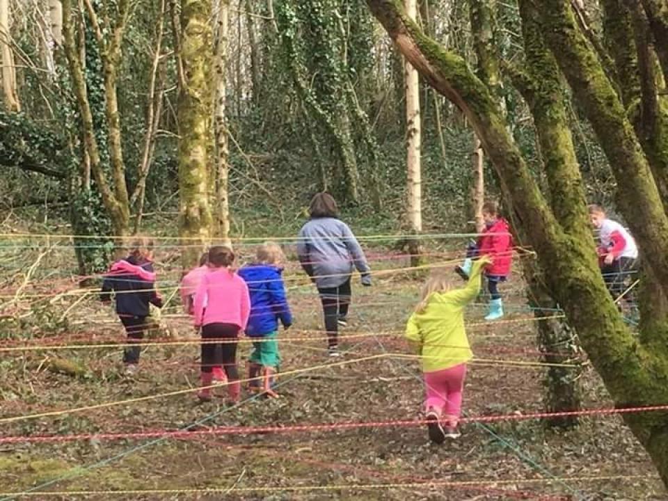 Children playing in the woods