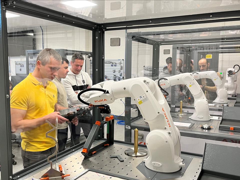 Person working with robotic arm