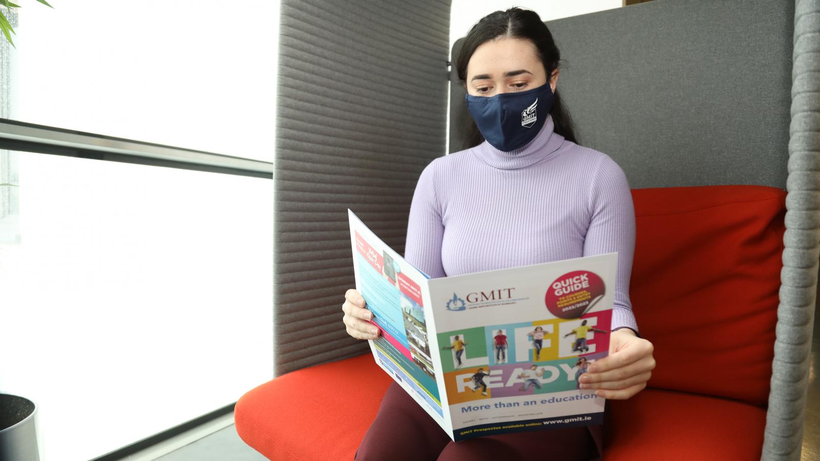 Student with brochure at GMIT Galway campus