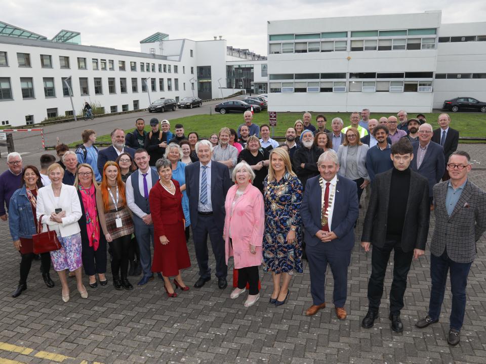 <p>Attendees at the flag-raising ceremony. Front row, L to R: Dr Debra Lattanzi Shutika, Fulbright Scholar to Ireland; Jo Corr; Cáit Noone, Head of Galway International Hotel School and Vice President International Engagement; Sarah Mohan, VP for Welfare, Students’ Union, ATU Galway-Mayo; Colin Kearney, Students’ Union President, ATU Galway-Mayo; Dr Orla Flynn, President, ATU; Dr Gay Corr, first Principal of RTC Galway; Marion Coy, past President of GMIT; Her Worship, the Mayor of the City of Galway, Cllr Clodagh Higgins; Cllr Michael (Moegie) Maher, Cathaoirleach of the County of Galway; Dr Mark McCarthy, Chair of the Golden Jubilee 1972–2022 Commemoration Committee; Dermot Nolan, President, Galway Chamber</p>
