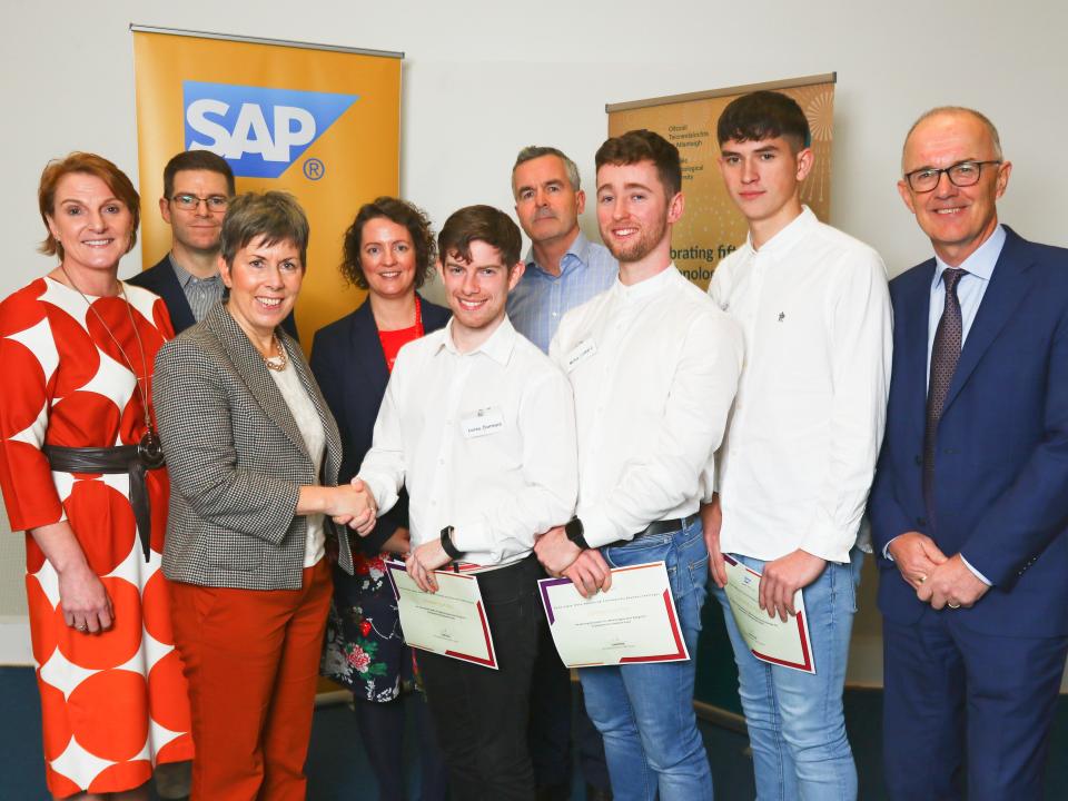 <p>Winner of the best academic poster in the category “Mobile application design for sustainable development goals” Adam Murphy from Coachford, Co Cork, Diarmuid Lucey from Macroom, Co Cork and Cathal Molloy from Douglas, Co Cork, pictured with ATU President Dr Orla Flynn, Managing Director of SAP Labs Ireland Liam Ryan, and staff from ATU and MTU.</p>
